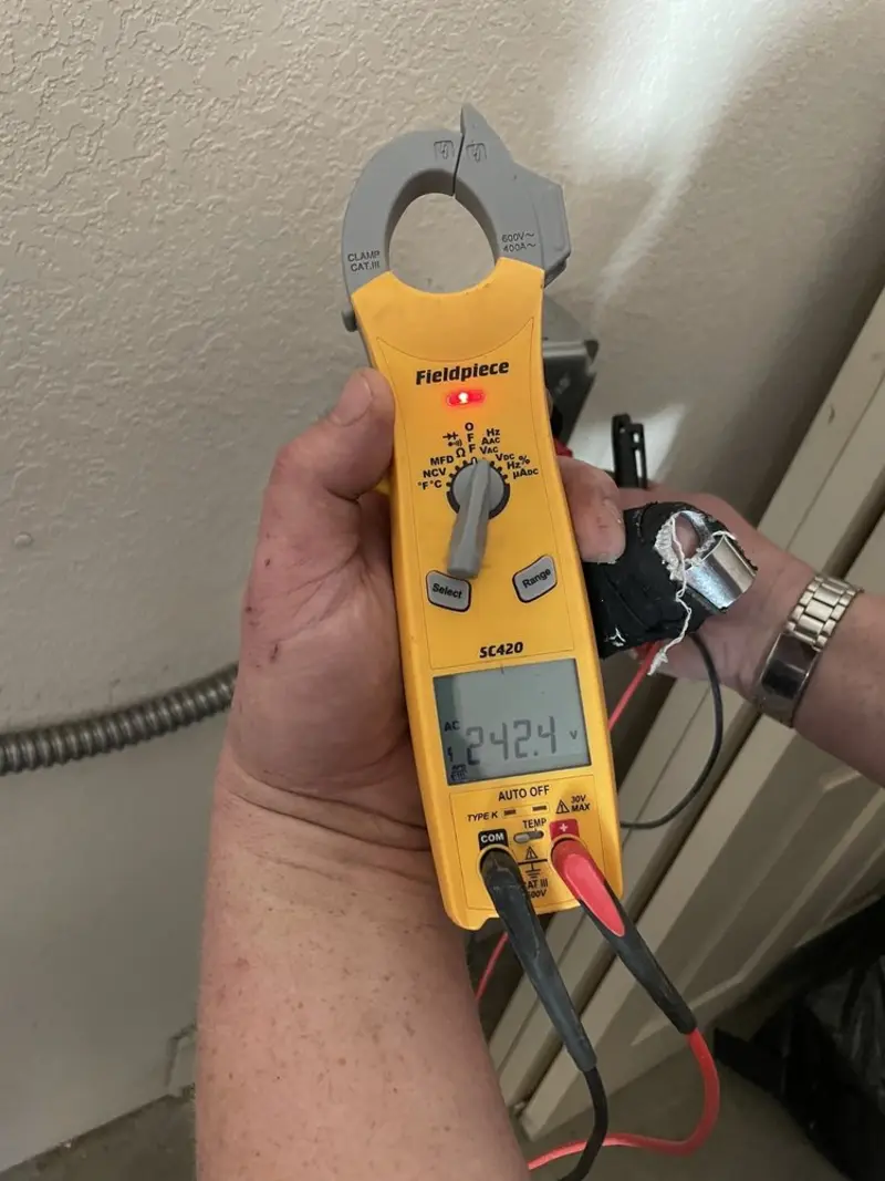 Voltage testing with clamp meter during Generator Installation in Arlington Heights